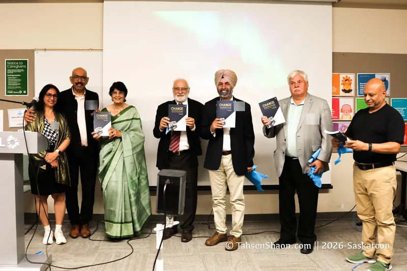 Speakers and guests on stage holding copies of Change Anesthesiology